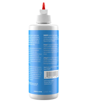 Andis 4oz clipper oil bottle with nozzle, designed for lubricating clipper parts and maintaining grooming tools.