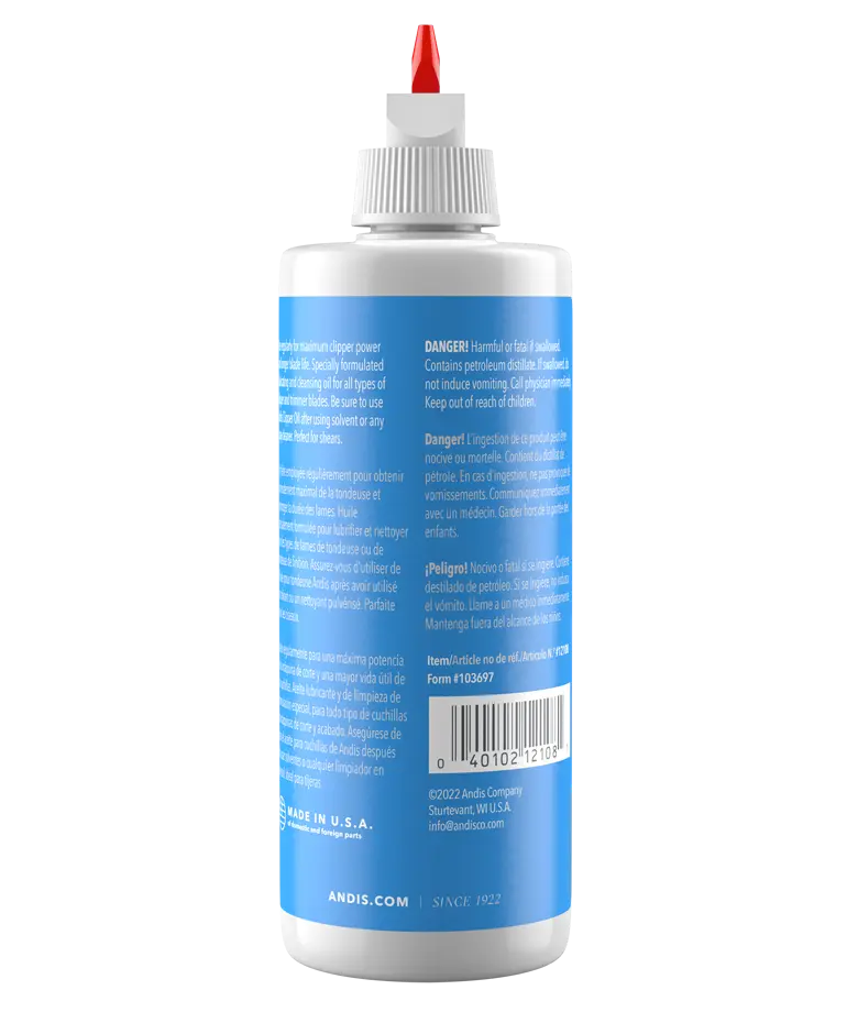 Andis 4oz clipper oil bottle with nozzle, designed for lubricating clipper parts and maintaining grooming tools.