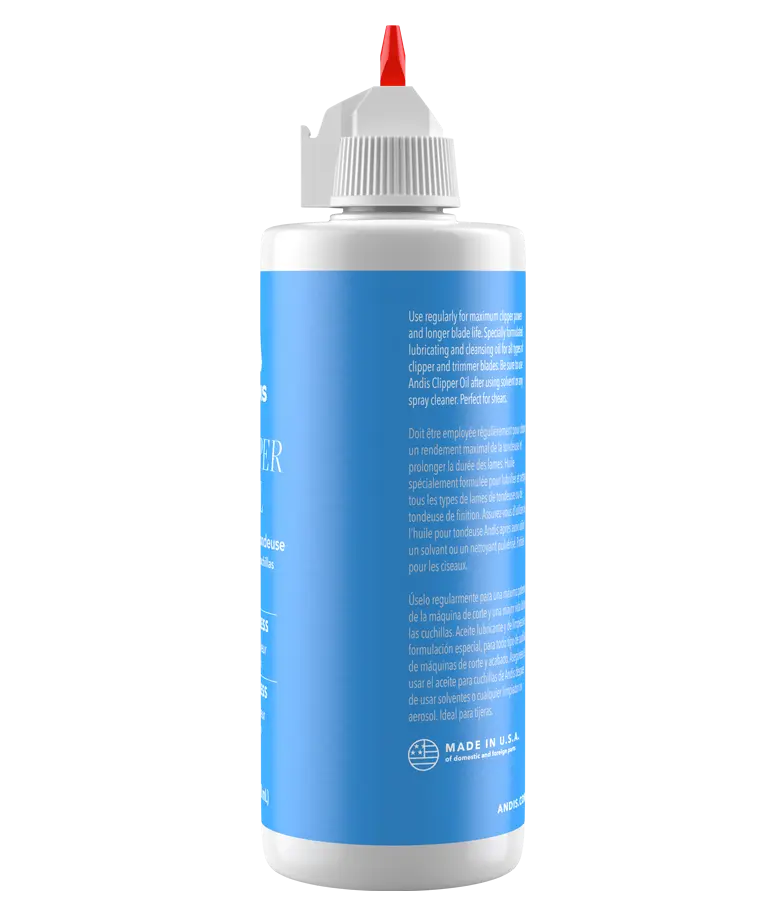 Andis 4oz clipper oil bottle with nozzle viewed from the side, used for maintaining and lubricating clipper parts.