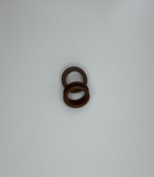 Pair of Groomer Supply House finger rings, small metal accessories for grooming or fashion, shown on a neutral background.